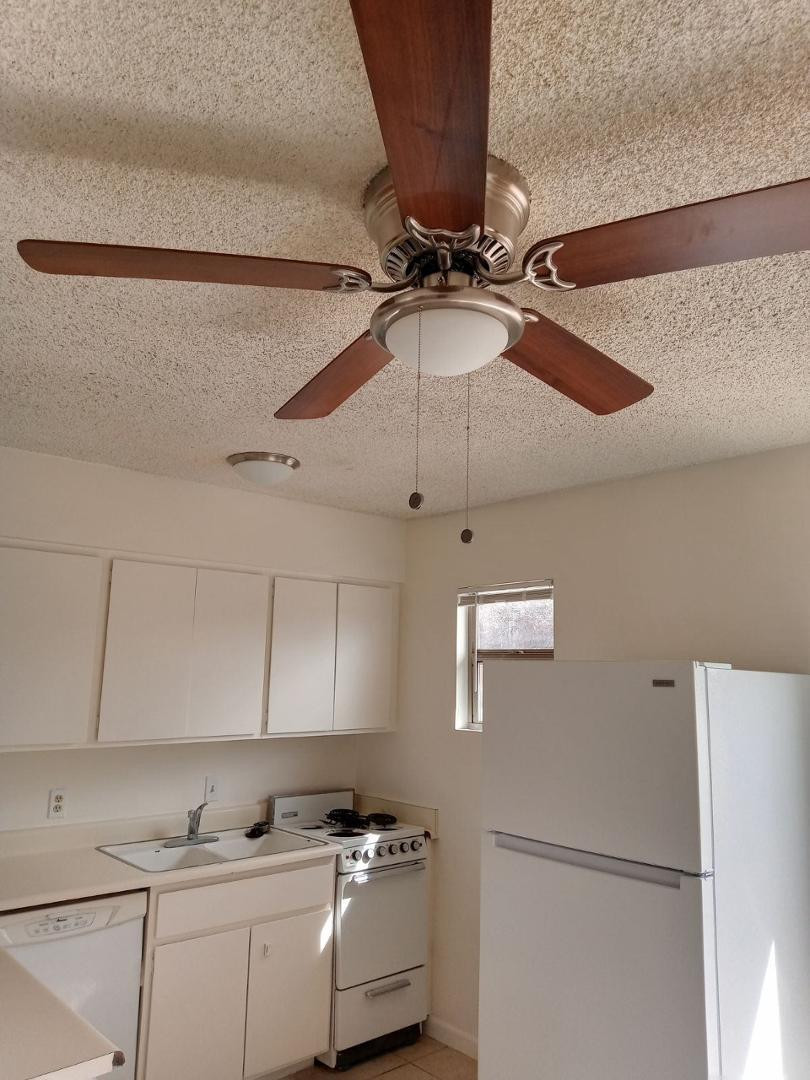 4140 East Cliffside Trail, Unit H Rimrock, AZ 86335 - Photo 10 of 15 a kitchen with stainless steel appliances a refrigerator and cabinets