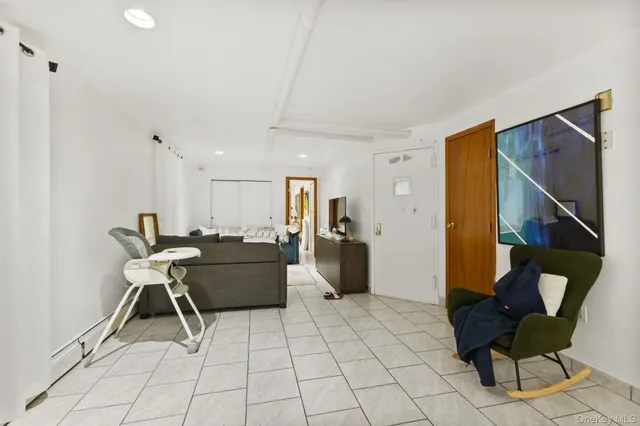 a living room with furniture and a rug