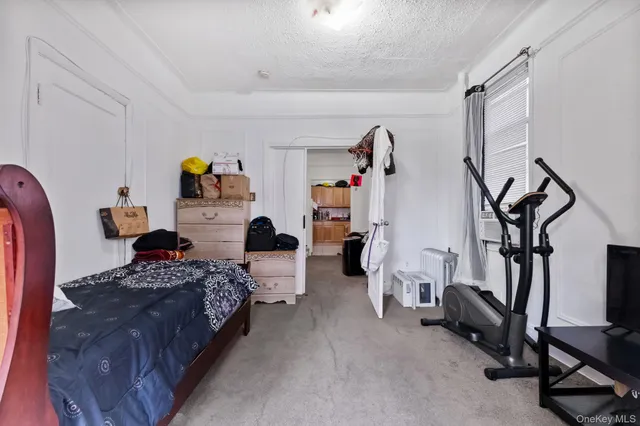 a bedroom with furniture and a window