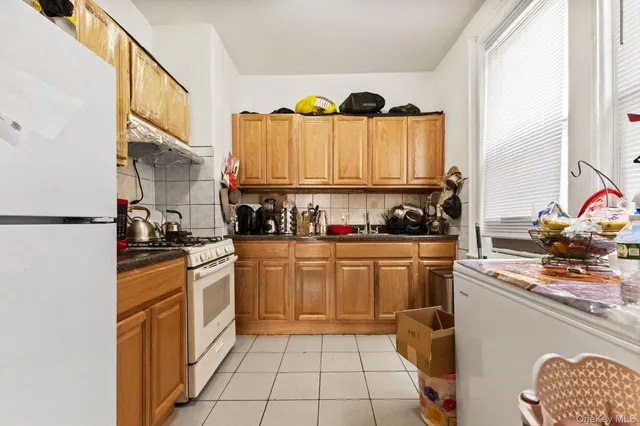 a kitchen with stainless steel appliances granite countertop a stove and a sink