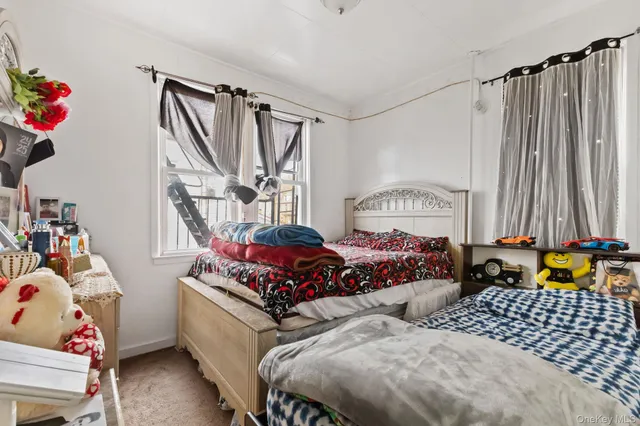 a bedroom with furniture and a window