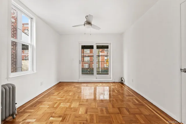 a view of an empty room with a window