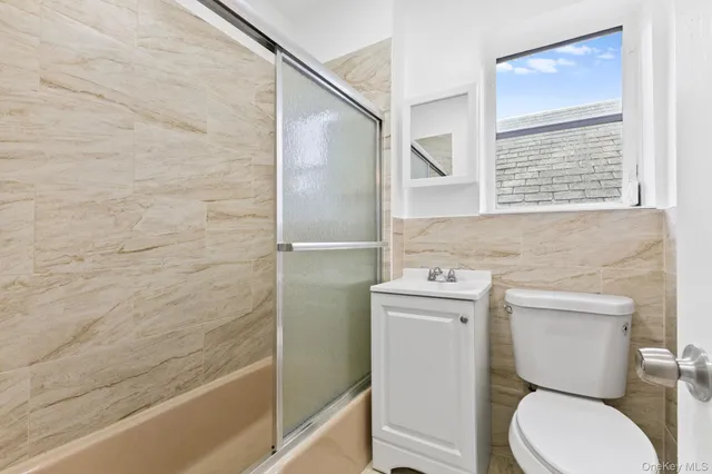 a bathroom with a toilet a sink and a bathtub