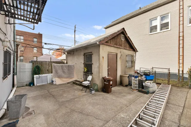 a view of a patio with a dining table and chairs