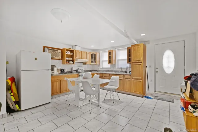 a living room with a couch and a dining table