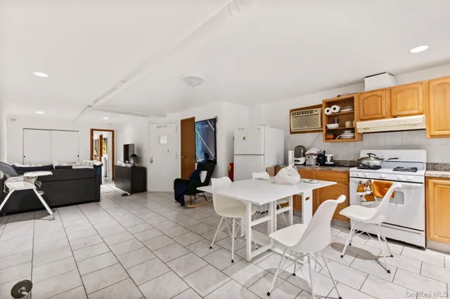 a kitchen with stainless steel appliances kitchen island granite countertop a sink and cabinets