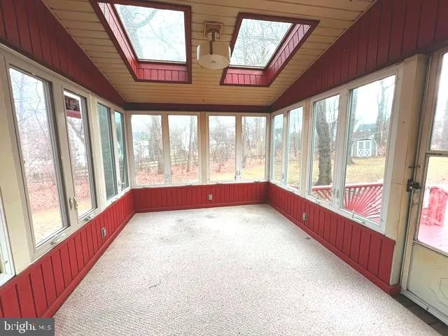 a view of an empty room with a balcony