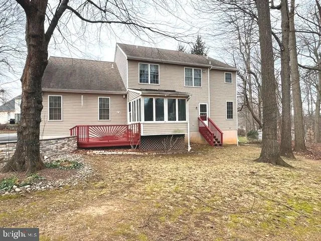 a house that has a tree in front of it