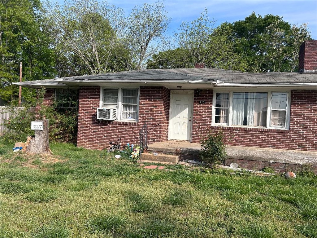 213 East Shockley Ferry Road Anderson, SC 29624 - Photo 12 of 20 This classic brick residence offers a charming exterior with a welcoming front entrance.