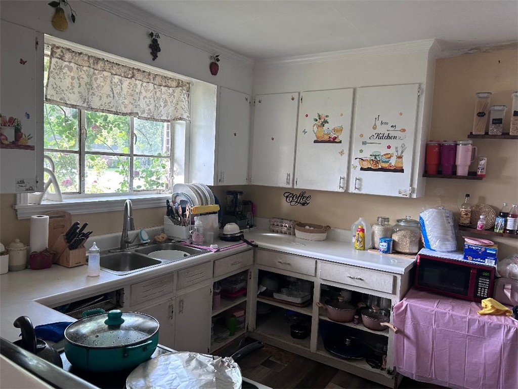 213 East Shockley Ferry Road Anderson, SC 29624 - Photo 14 of 20 This kitchen offers functionality and natural light, featuring practical amenities for everyday living.
