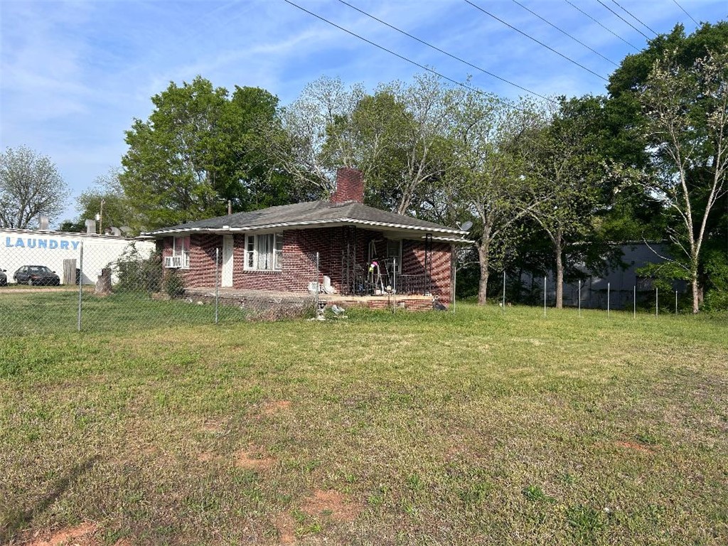 213 East Shockley Ferry Road Anderson, SC 29624 - Photo 2 of 20 This classic brick residence offers a spacious yard, creating a charming exterior for comfortable living.
