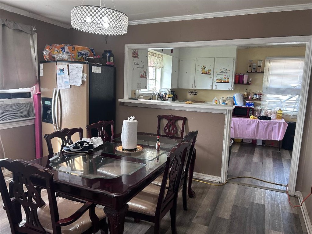 213 East Shockley Ferry Road Anderson, SC 29624 - Photo 10 of 20 This inviting dining area features a stylish chandelier, offering a perfect spot for everyday meals.