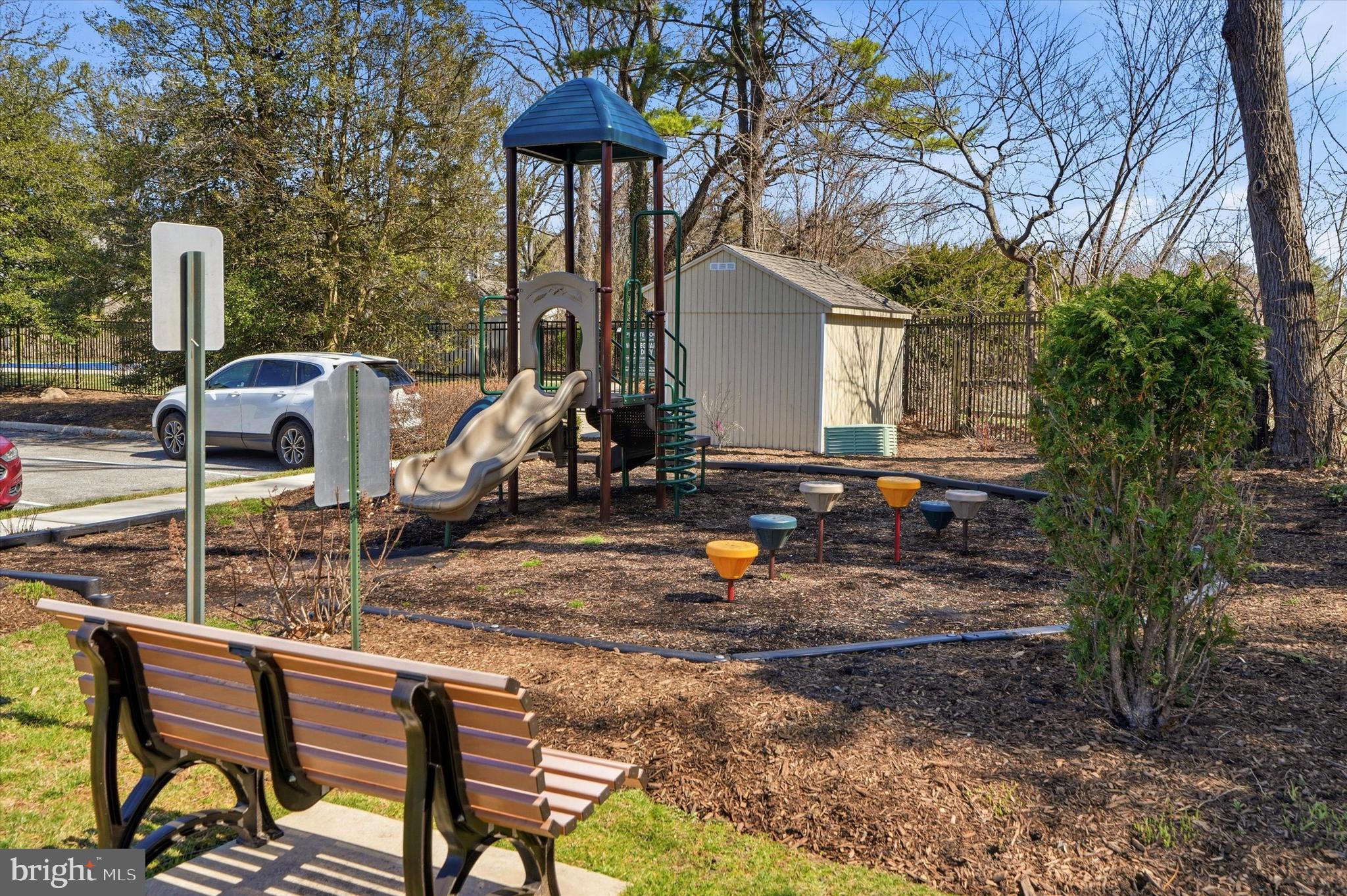 207 Walnut Hill Road, Unit B1 West Chester, PA 19382 - Photo 11 of 13 a backyard of a house with barbeque oven table and chairs