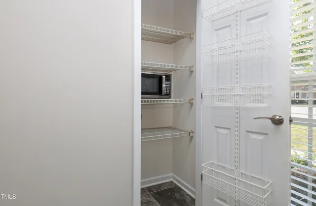 a bathroom with a granite countertop shower