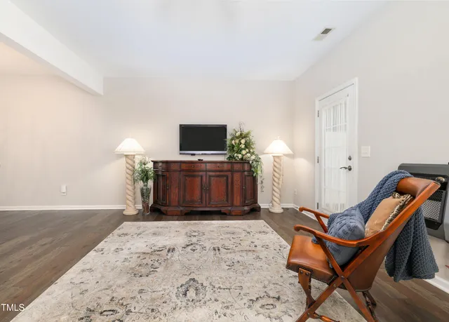a room with furniture and a flat screen tv