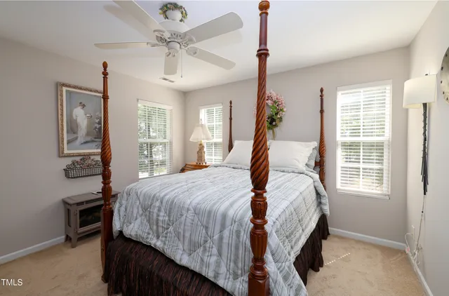 a bed room with a bed and a window