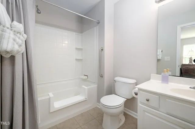 a bathroom with a toilet a sink and a bathtub