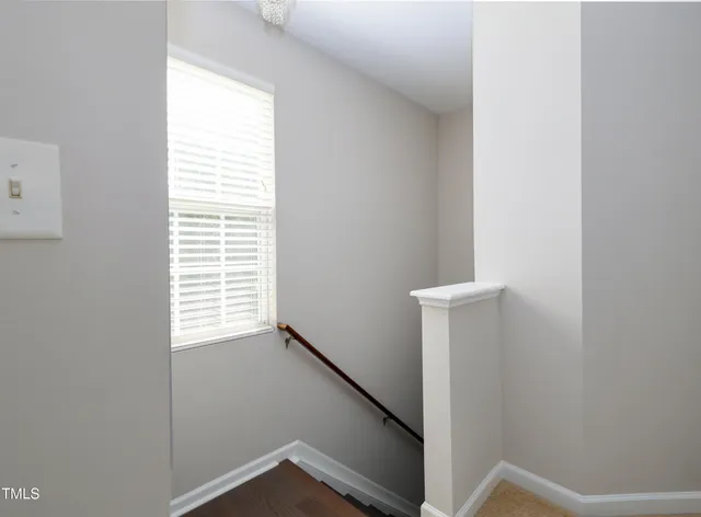 a view of a hallway with windows