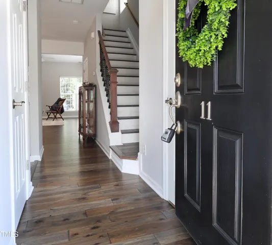 a view of entryway with livingroom and wooden floor