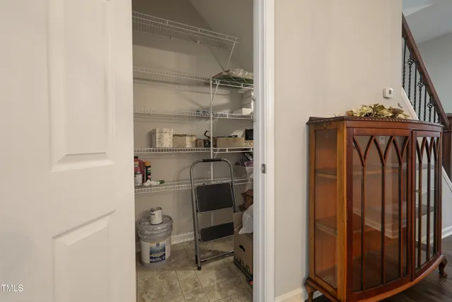 a kitchen with a refrigerator and cabinets