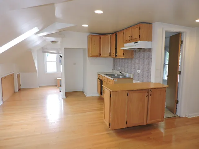 a bathroom with a bathtub a sink and a shower