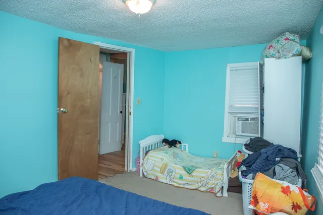 a bathroom with a sink mirror and toilet