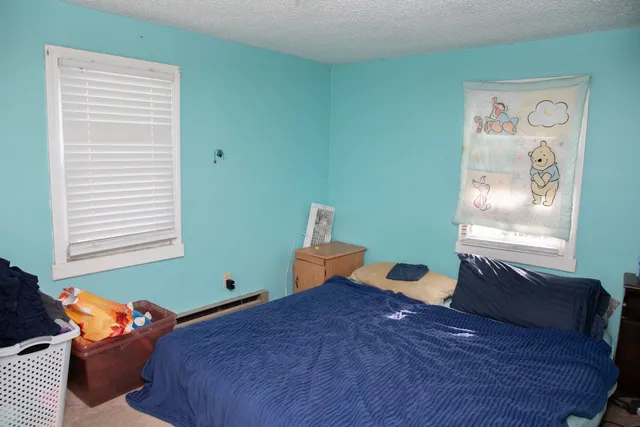 a room with furniture and a flat screen tv