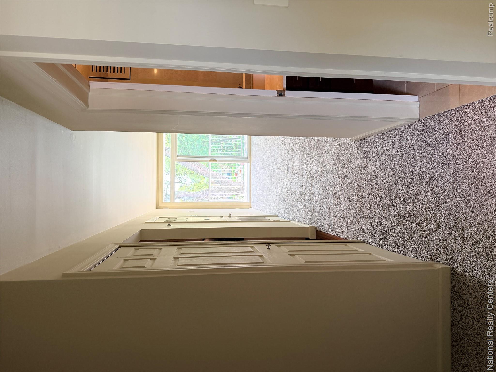 4913 Crooks Road, Unit G4 Royal Oak, MI 48073 - Photo 17 of 19 16_Hall Looking at Balcony.JPG