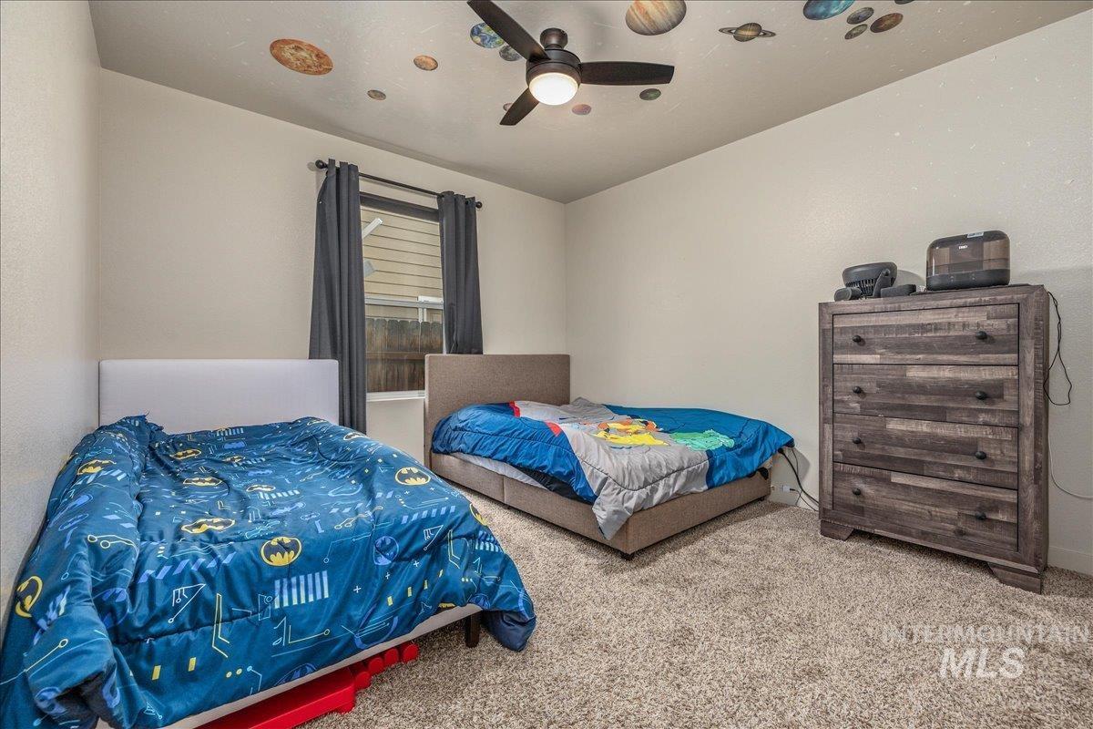 661 North Scotney Avenue Meridian, ID 83642 - Photo 14 of 22 Bedroom with carpet flooring and a ceiling fan