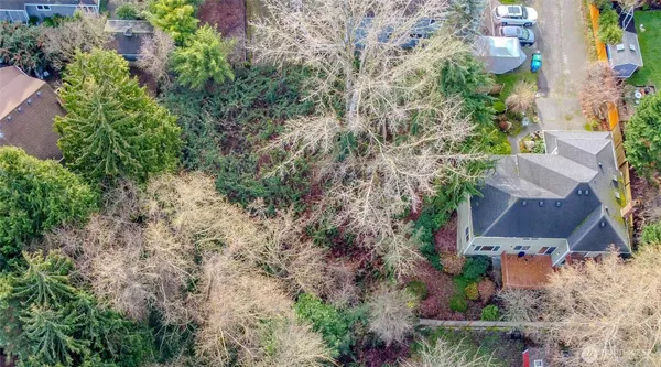 an aerial view of house with yard