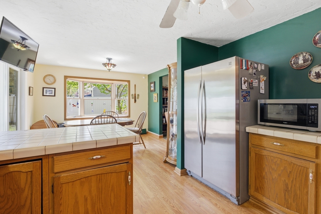 19 Mockingbird Lane Maynard, MA 01754 - Photo 10 of 34 a kitchen with a refrigerator and a sink