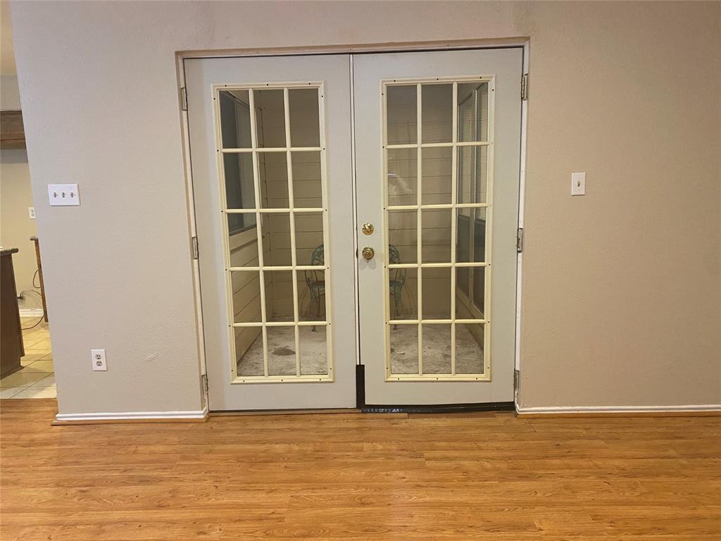 3035 Allister Street Dallas, TX 75229 - Photo 14 of 32 French doors open to Sun Room