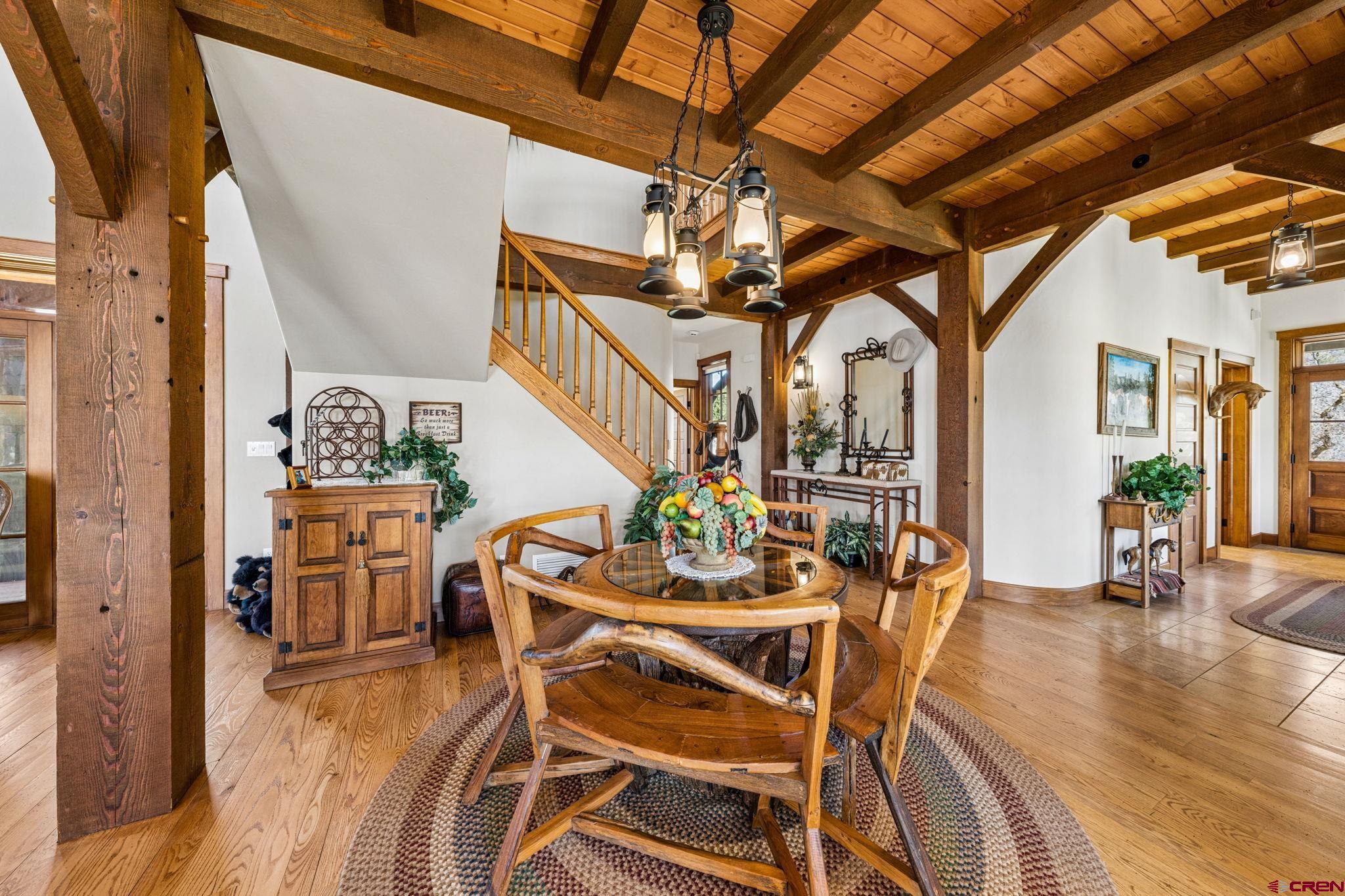 3623 Elkhorn Mountain Road Durango, CO 81301 - Photo 11 of 44 a dining room with furniture entryway and wooden floor