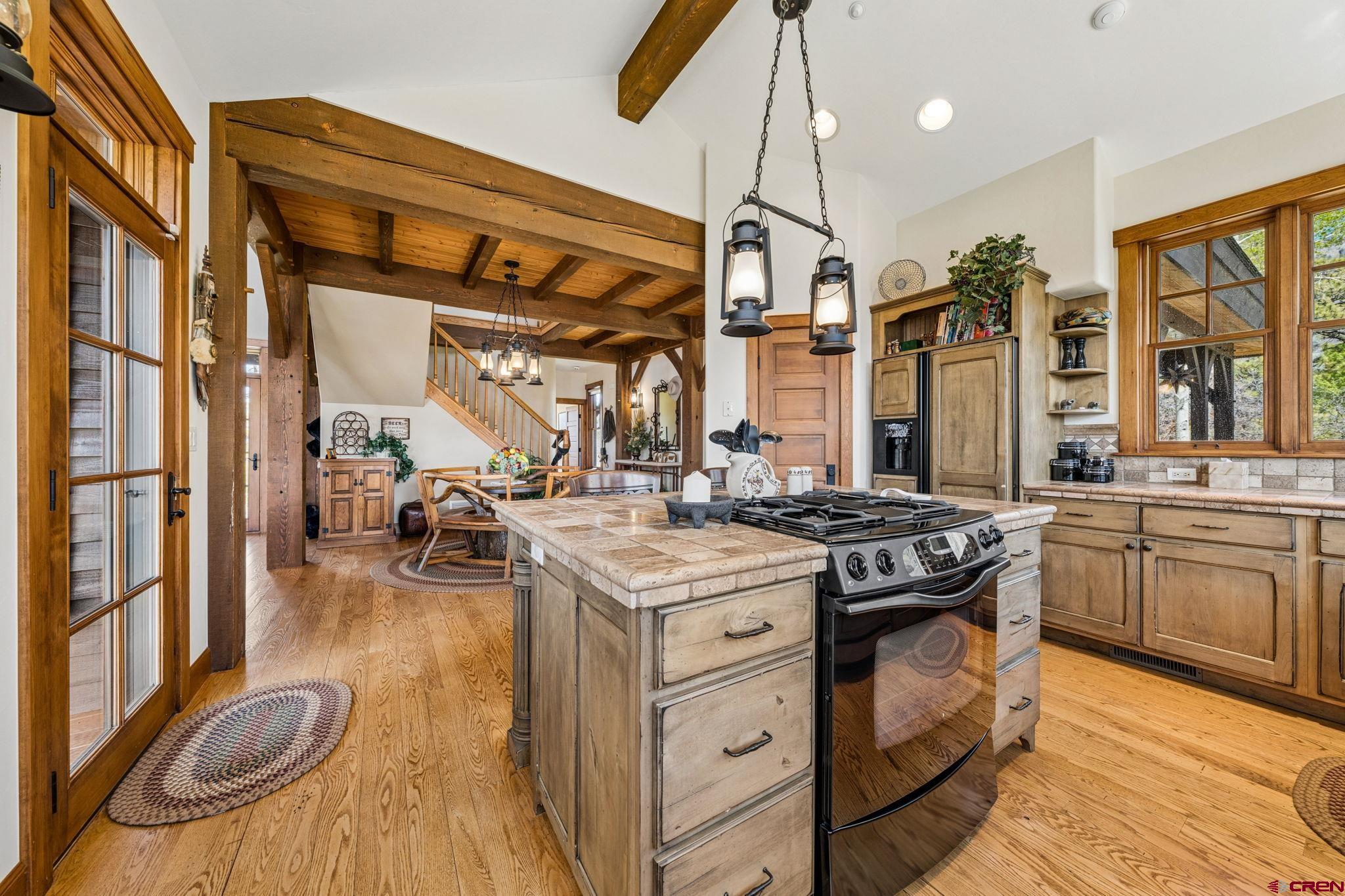 3623 Elkhorn Mountain Road Durango, CO 81301 - Photo 14 of 44 a kitchen with sink stove and cabinets