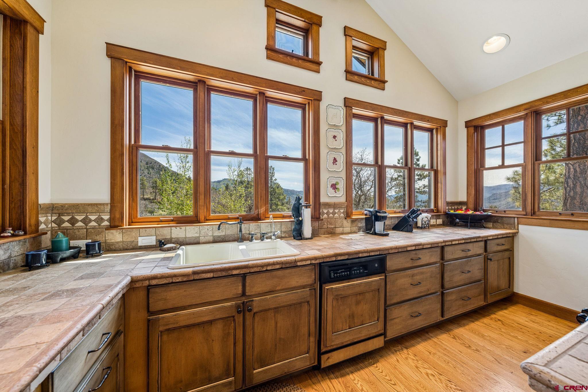 3623 Elkhorn Mountain Road Durango, CO 81301 - Photo 15 of 44 a kitchen with a sink and large windows