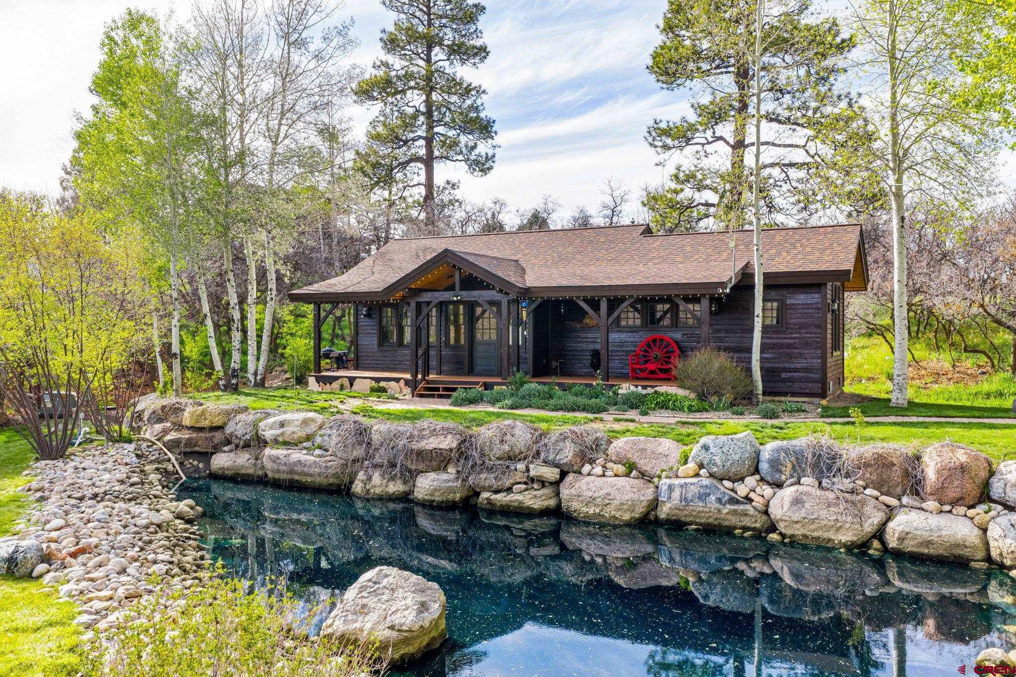 3623 Elkhorn Mountain Road Durango, CO 81301 - Photo 2 of 44 a view of swimming pool with lawn chairs and plants