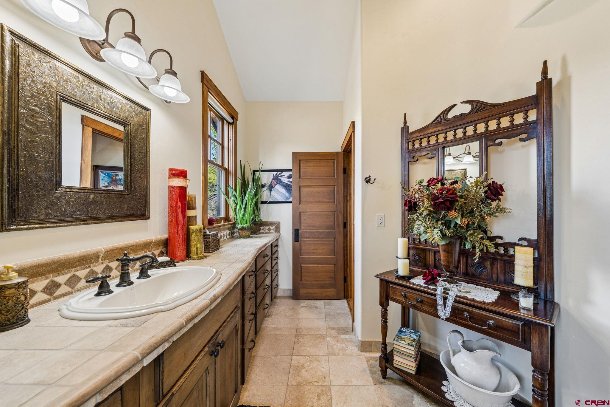 3623 Elkhorn Mountain Road Durango, CO 81301 - Photo 21 of 44 a bathroom with a sink double vanity and a mirror