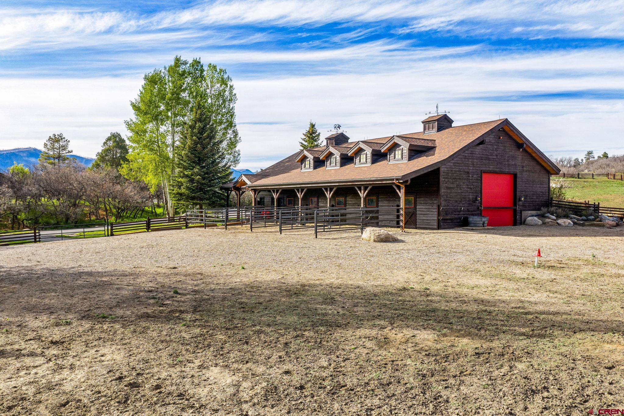 3623 Elkhorn Mountain Road Durango, CO 81301 - Photo 25 of 44 a view of a white house with a yard