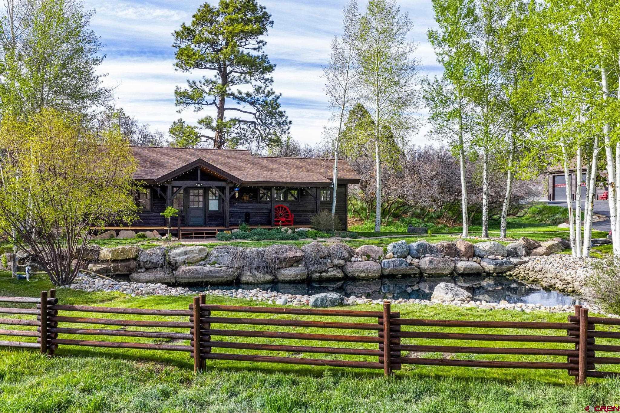 3623 Elkhorn Mountain Road Durango, CO 81301 - Photo 30 of 44 a front view of a house with a yard