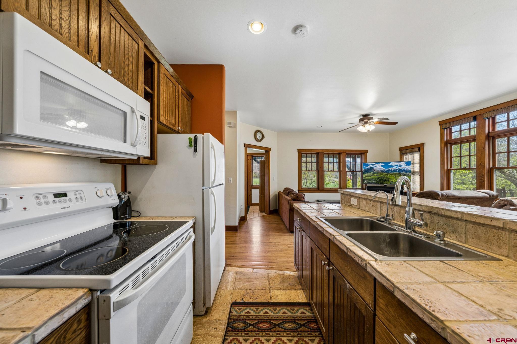 3623 Elkhorn Mountain Road Durango, CO 81301 - Photo 32 of 44 a kitchen that has a sink and a stove