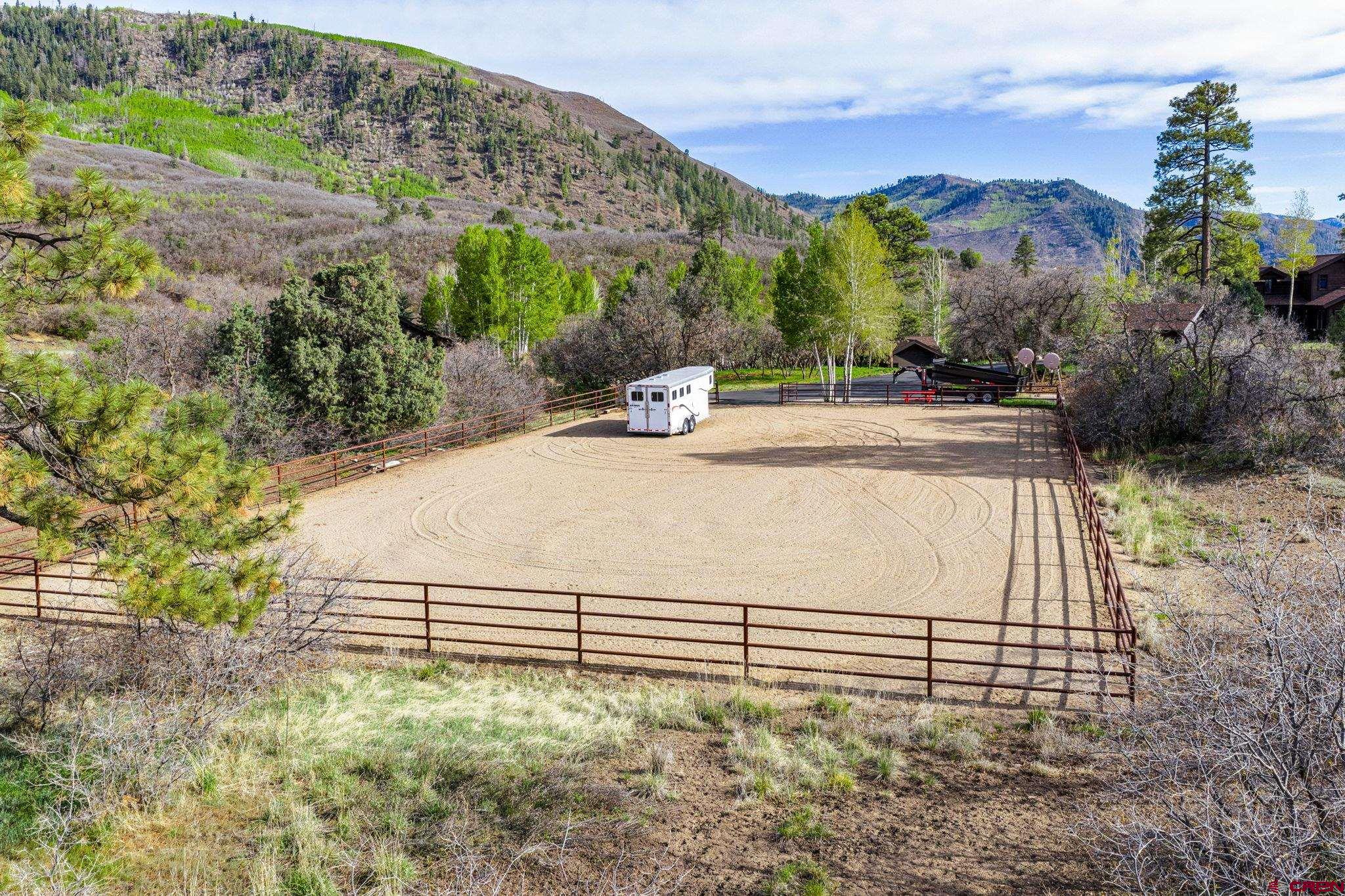 3623 Elkhorn Mountain Road Durango, CO 81301 - Photo 5 of 44 a view of a dry yard with large trees