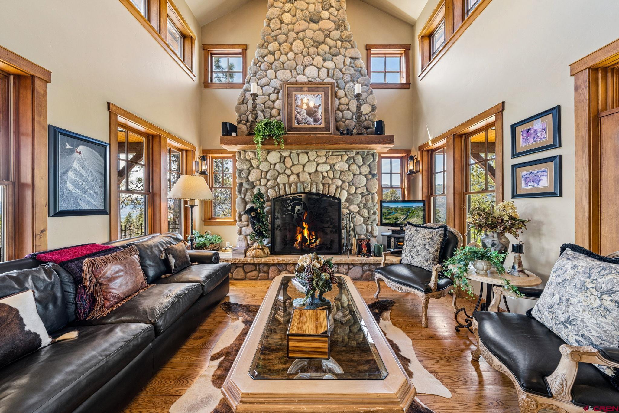 3623 Elkhorn Mountain Road Durango, CO 81301 - Photo 9 of 44 a living room with furniture fireplace and a large window