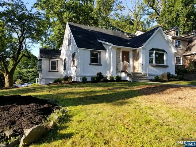 a front view of a house with swimming pool