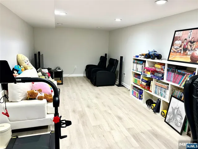 a bedroom with furniture and a book shelf