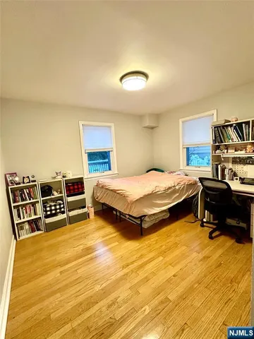 a bedroom with a bed and a chair