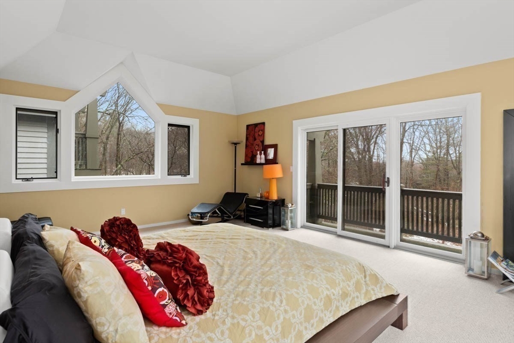 7 Northedge Road Hamilton, MA 01982 - Photo 19 of 42 a bed sitting in a bedroom next to a window