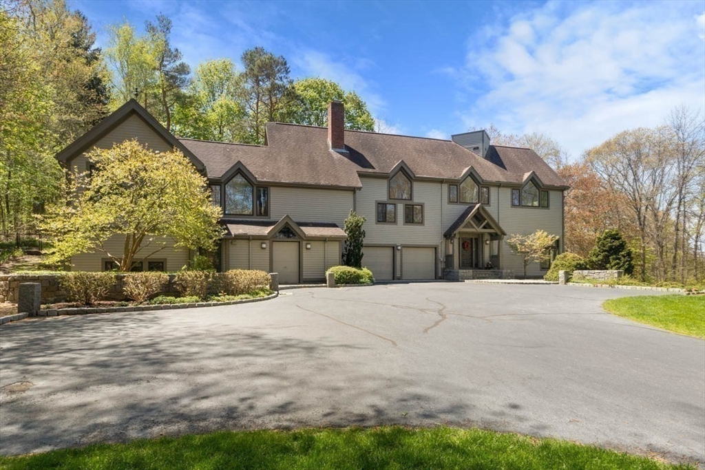 7 Northedge Road Hamilton, MA 01982 - Photo 34 of 42 a front view of a house with a yard and garage