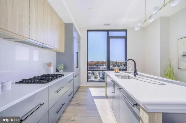 a bathroom with a toilet sink a mirror and bathtub