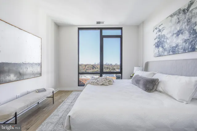 a bathroom with a granite countertop sink toilet a mirror and bathtub