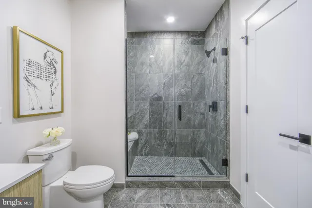 a bedroom with a large bed and a large window